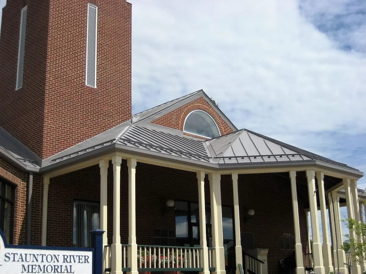 Skilled roofing craftsmen working on a residential roof in Boxwood Village
